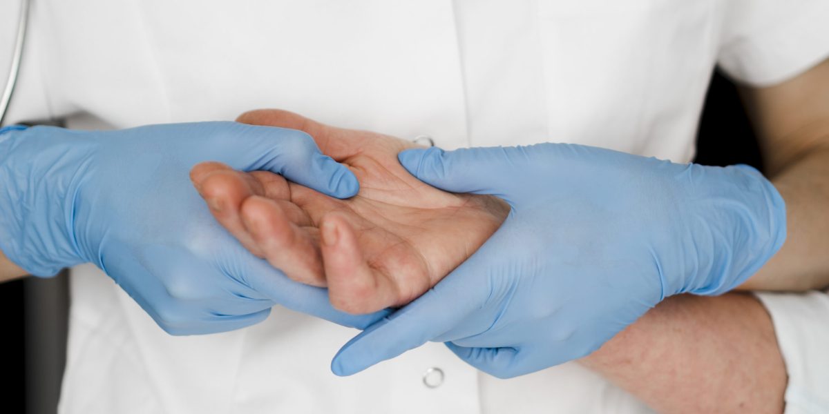 close-up-doctor-checking-palm-scaled-1