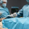 different-doctors-doing-surgical-procedure-patient-scaled-1
